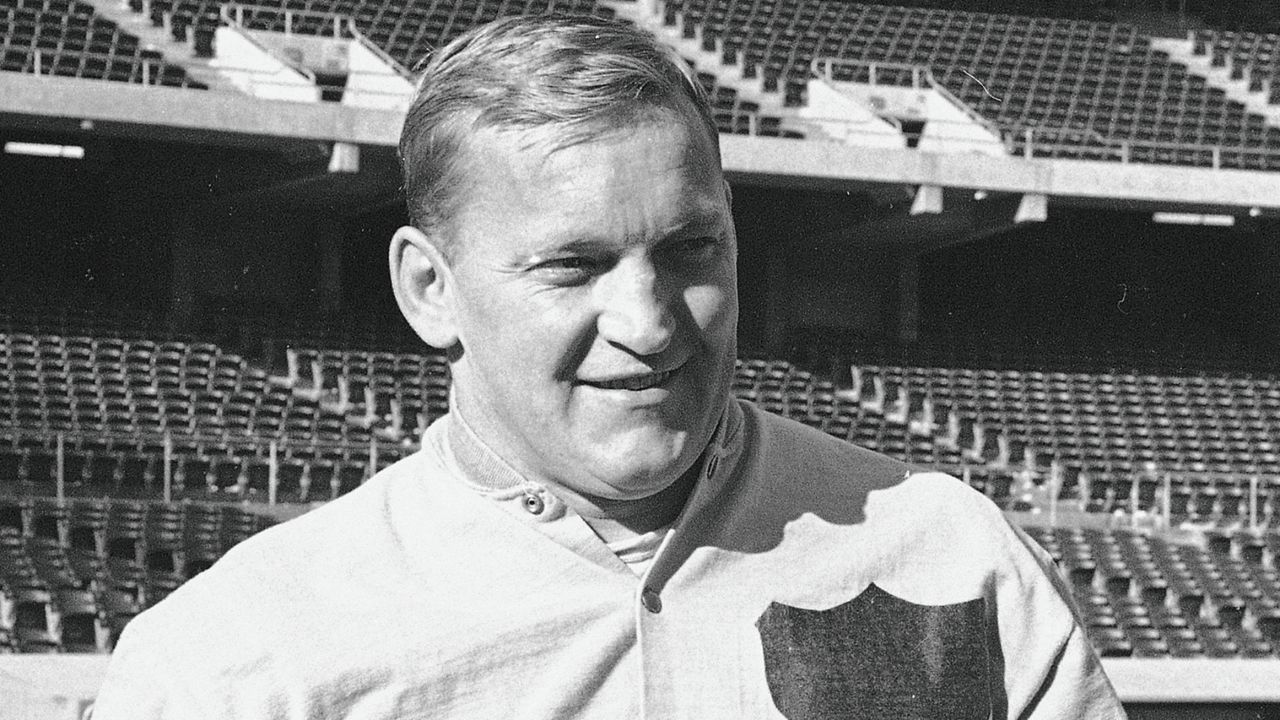 Oakland Raiders center Jim Otto gets footballs ready for a practice session, Jan. 3, 1968, at Oakland Coliseum, home of the AFL champions. (AP Photo/Ernest Bennett)