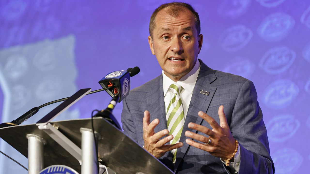 Atlantic Coast Conference Commissioner Jim Phillips answers a question during an NCAA college football news conference at the ACC media days in Charlotte, N.C., Wednesday, July 20, 2022. Phillips says he never “condoned or tolerated inappropriate conduct” against athletes as Northwestern's athletics director in the wake of that school's hazing scandal, which has led to at least three lawsuits and the firing of football coach Pat Fitzgerald. (AP Photo/Nell Redmond, File)