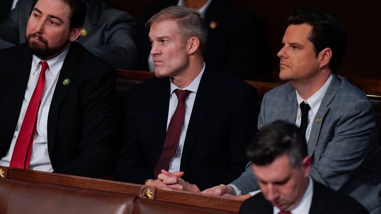 Rep. Eli Crane, R-Ariz., left, Rep. Jim Jordan, R-Ohio, and Rep. Matt Gaetz, R-Fla., listen tot he 14th vote in the House chamber as the House meets for the fourth day to elect a speaker and convene the 118th Congress in Washington, Friday, Jan. 6, 2023. (AP Photo/Alex Brandon)