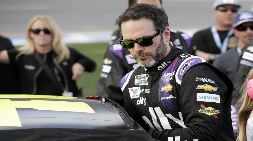 FILE - In this Feb. 16, 2020 file photo Jimmie Johnson climbs intp his car before the NASCAR Daytona 500 auto race at Daytona International Speedway in Daytona Beach, Fla. NASCAR seven-time champion Jimmie Johnson will test an Indy car next week on the road course at Indianapolis Motor Speedway. He’s long said he is open to racing in the series but did not want to compete on ovals out of safety concerns. On Friday, July 3, 2020, he indicated recent safety improvements have softened his stance and the Indianapolis 500 is not entirely out of the picture.(AP Photo/John Raoux, File)