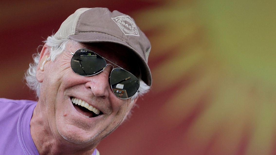 Jimmy Buffett performs on the Acura Stage during the New Orleans Jazz and Heritage Festival at the Fairgrounds in New Orleans Sunday, April 26, 2015. Buffett, who popularized beach bum soft rock with the escapist Caribbean-flavored song “Margaritaville” and turned that celebration of loafing into an empire of restaurants, resorts and frozen concoctions, has died, Friday, Sept. 1, 2023. (Brett Duke /The Times-Picayune/The New Orleans Advocate via AP)