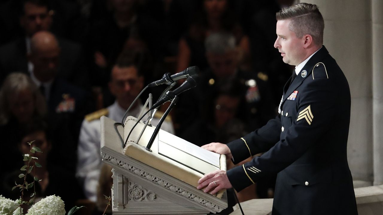 FILE - Jimmy McCain reads the poem “The Requiem,” at a memorial service for his father, Sen. John McCain, R-Ariz., at Washington National Cathedral in Washington, Saturday, Sept. 1, 2018. McCain died Aug. 25, from brain cancer at age 81. (AP Photo/Pablo Martinez Monsivais)