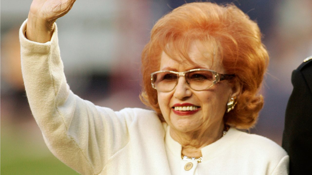 Joan Hodges, the widow of the late New York Mets player Gil Hodges waves to fans as the Mets honored Gil Hodges before a baseball game against the Houston Astros, Friday, Sept. 7, 2007 at Shea Stadium in New York. (AP Photo/Ed Betz)