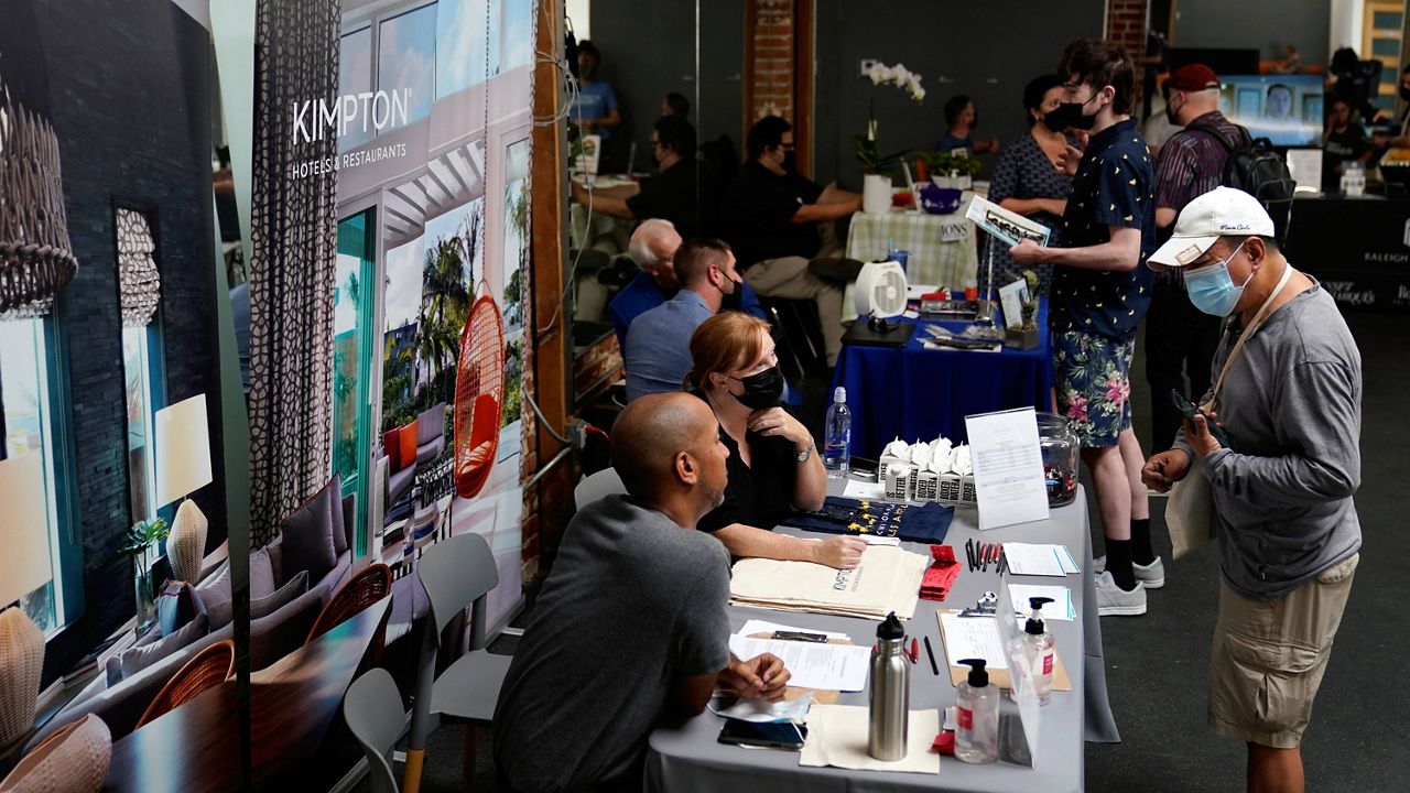 Prospective employers and job seekers interact during during a job fair on Sept. 22, 2021, in the West Hollywood section of Los Angeles. (AP Photo/Marcio Jose Sanchez, File)