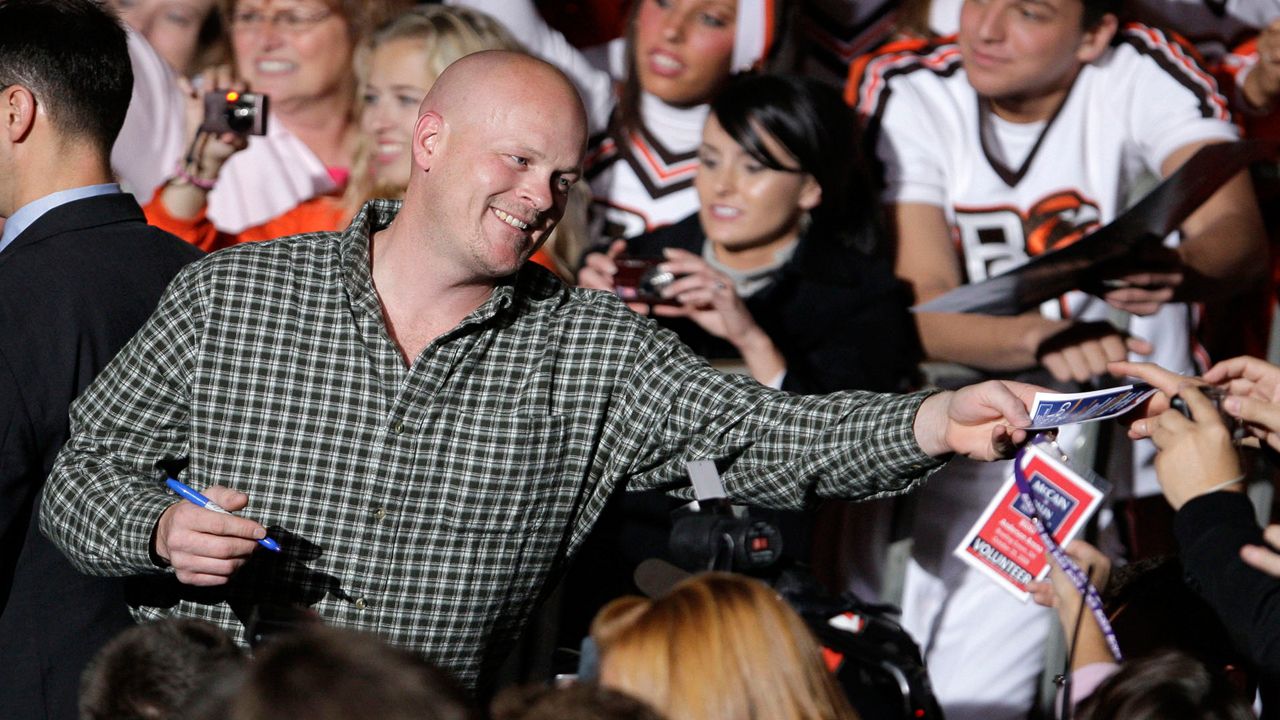 Joe Wurzelbacher, also known as "Joe the Plumber," signs autographs after appearing at a rally with Republican vice presidential candidate, Alaska Gov. Sarah Palin, at Bowling Green University in Bowling Green, Ohio, Oct. 29, 2008. Wurzelbacher, who was thrust into the political spotlight as “Joe the Plumber” after questioning Barack Obama about his economic policies during the 2008 presidential campaign, has died, his son said Monday, Aug. 28, 2023. He was 49. His oldest son, Joey Wurzelbacher, said his father died Sunday, Aug. 27, in Wisconsin after a long illness. (AP Photo/Amy Sancetta, File)