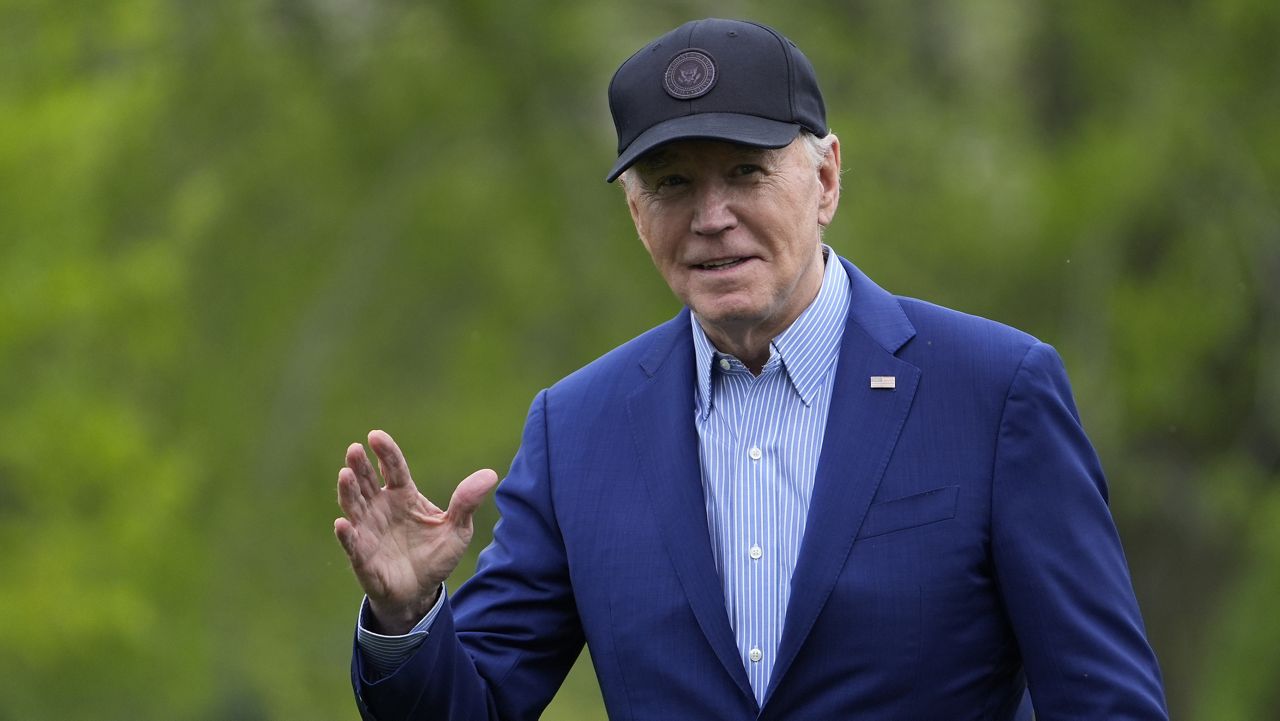 President Joe Biden waves as he walks across the South Lawn of the White House in Washington, Wednesday, April 17, 2024, after returning from a trip to Pennsylvania. (AP Photo/Susan Walsh)