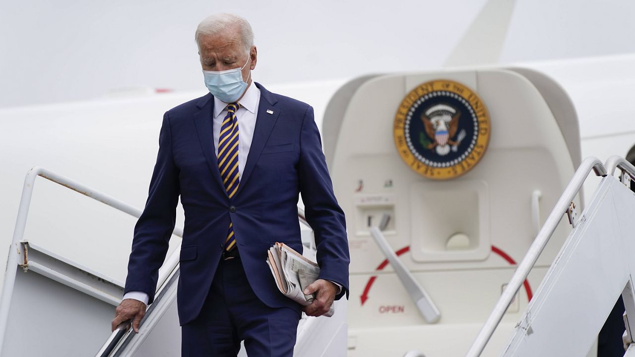 President Joe Biden steps off Air Force One on Friday at Dover Air Force Base, Del. (AP Photo/Patrick Semansky)