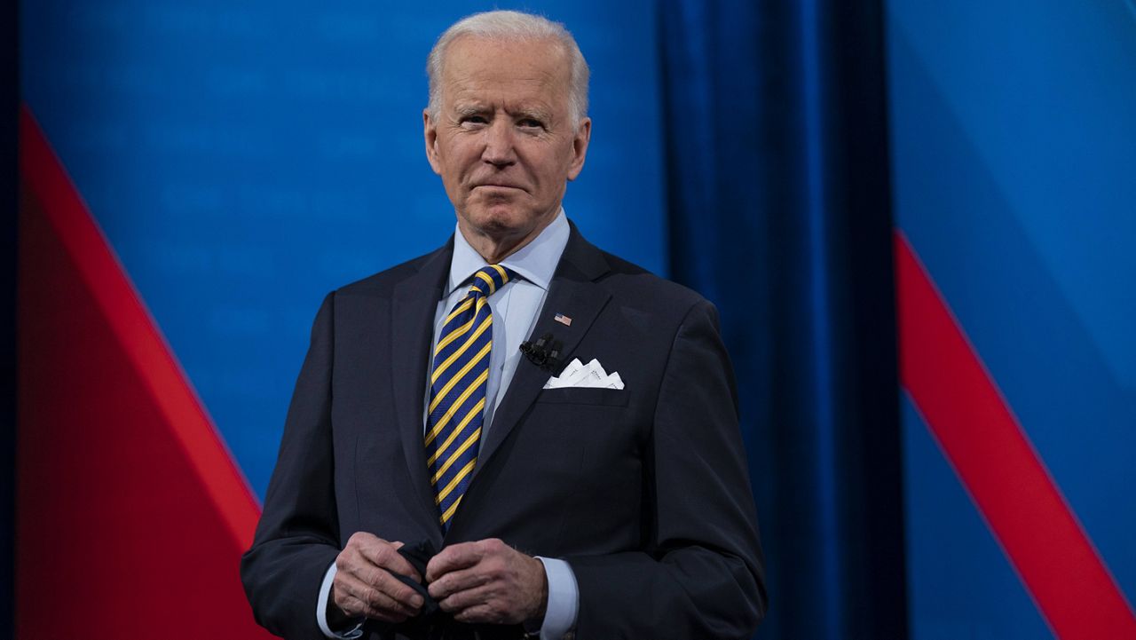 President Joe Biden talks with audience members during a CNN town hall in Milwaukee on Tuesday. (AP Photo/Evan Vucci)