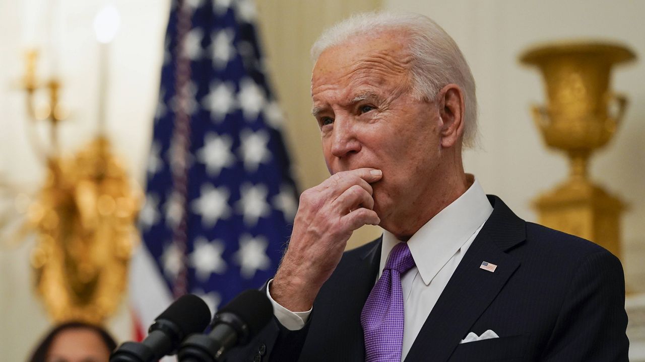 President Joe Biden pauses as he speaks about the coronavirus in the State Dining Room of the White House on Thursday. (AP Photo/Alex Brandon)