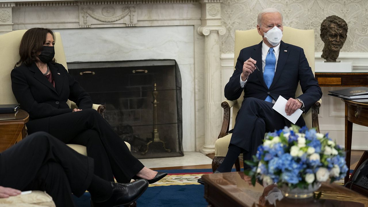 President Joe Biden, flanked by Vice President Kamala Harris, talks to reporters before a meeting with governors and mayors Friday at the White House. (AP Photo/Evan Vucci)