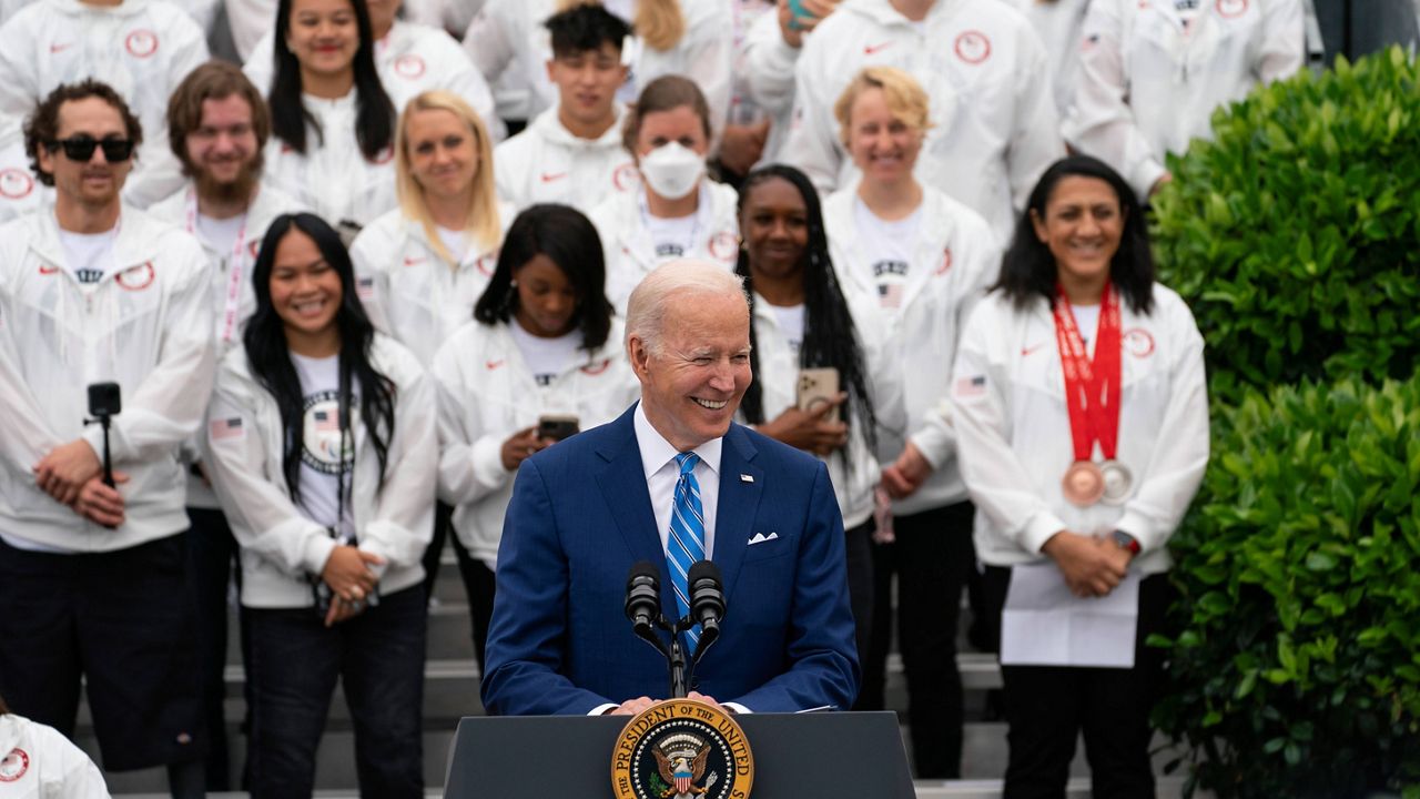 President Joe Biden laughs Wednesday during an event honoring Team USA Olympians and Paralympians on the South Lawn of the White House. (AP Photo/Evan Vucci)