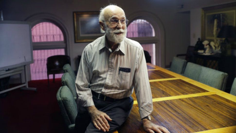 In this Tuesday, Nov. 28, 2017 photo, Joe Holcombe visits with an attorney as he waits for an interview, in San Antonio. Holcombe, who lost eight members of his family in a shooting that killed more than two dozen people at a Texas church including his son Bryan, filed a claim on Tuesday against the U.S. Air Force, alleging the agency's failure to report the criminal history of the gunman to an FBI database used to check the backgrounds of gun buyers helped cause his loved one's death. (AP Photo/Eric Gay)