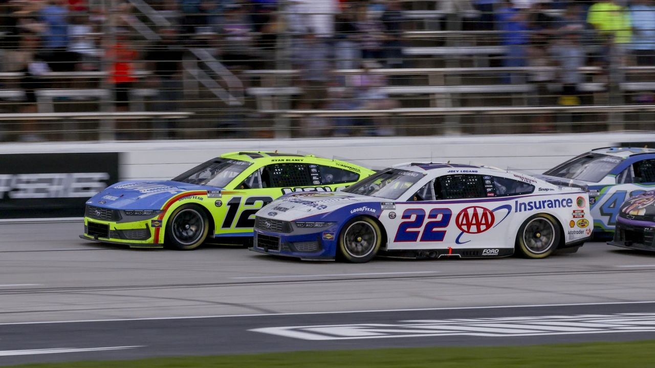 Ryan Blaney (12) and Joey Logano (22) lead the pack following a caution during a NASCAR Cup Series auto race at Texas Motor Speedway in Fort Worth, Texas, Sunday, May 4, 2025. (AP Photo/Gareth Patterson)
