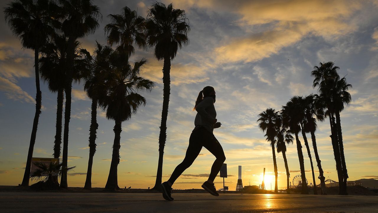 A jogger runs on Santa Monica State Beach in Santa Monica, Calif. (AP Photo/Mark J. Terrill)