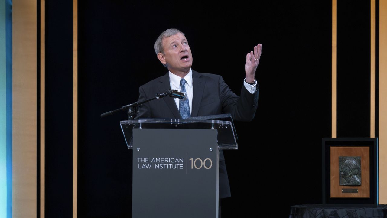 Supreme Court Chief Justice John Roberts speaks Tuesday as he receives the Henry J. Friendly Medal during the American Law Institute's annual dinner in Washington. (AP Photo/Jose Luis Magana)