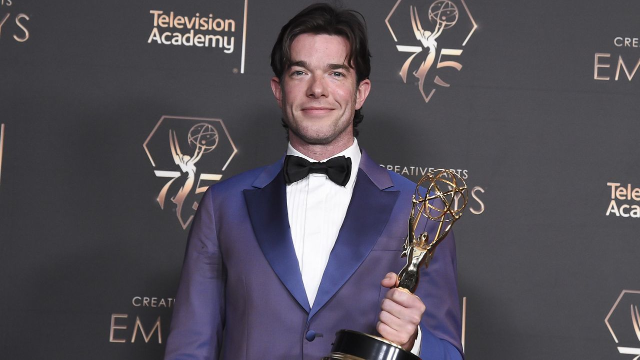 John Mulaney poses in the press room with the award for outstanding writing for a variety special for "Baby J" during night two of the Creative Arts Emmy Awards on Sunday Jan. 7, 2024, at the Peacock Theater in Los Angeles. (Photo by Richard Shotwell/Invision/AP)