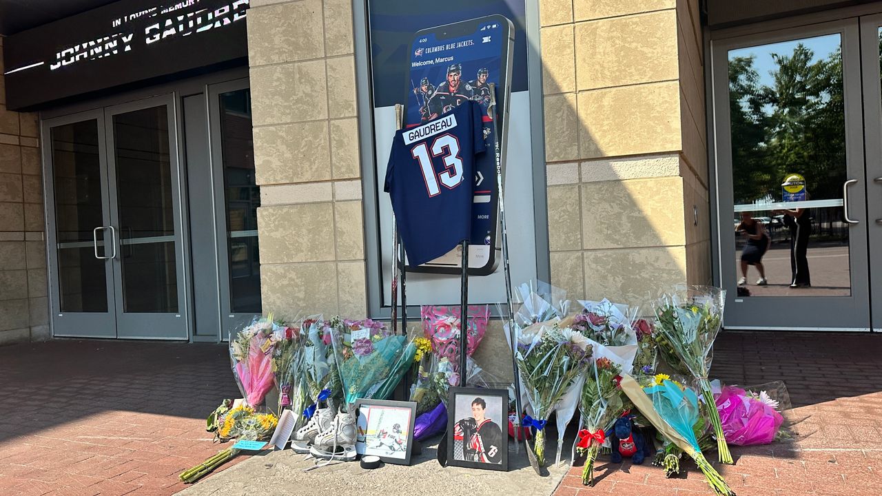 Flowers, photos and more as a memorial to Johnny Gaudreau.