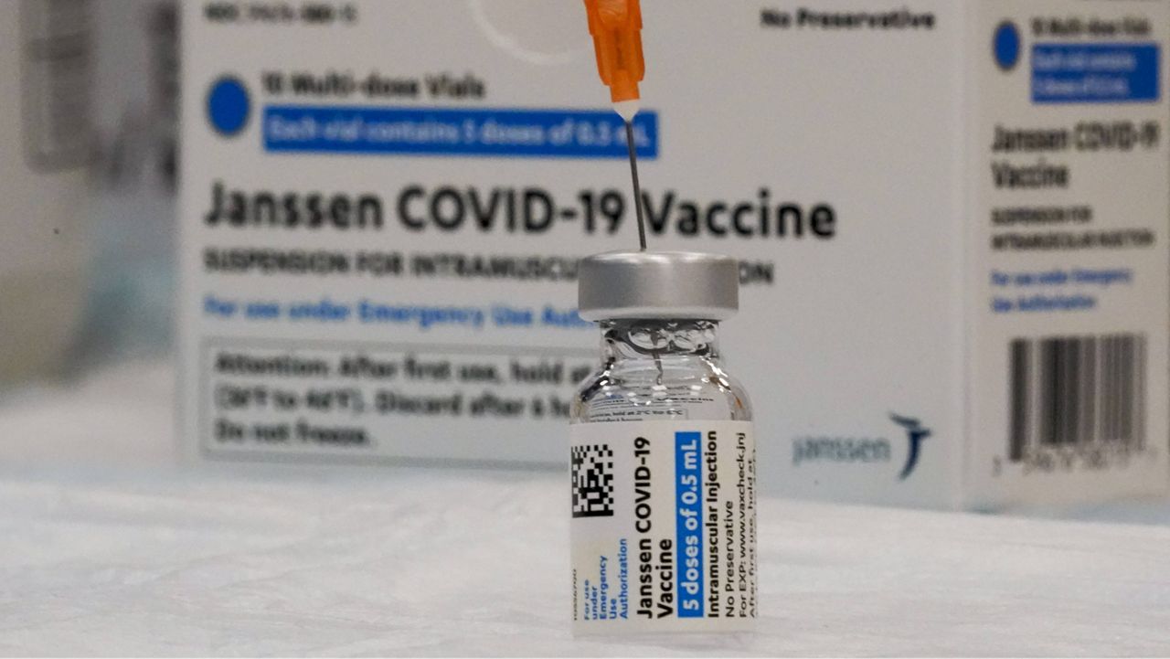 A syringe is inserted into a vial of the Johnson & Johnson COVID-19 vaccine (AP Photo, File)