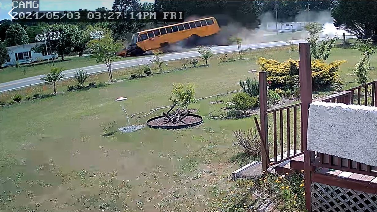 A Johnston County Public Schools bus is seen on surveillance camera video as it crashes Friday afternoon after the N.C. State Highway Patrol says it was struck by a hit-and-run driver. (Courtesy Rodolfo Gonzalez)
