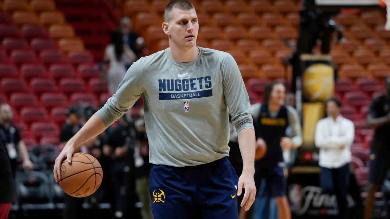 Denver Nuggets center Nikola Jokic practices Tuesday for Game 3 of the NBA Finals in Miami on Wednesday. Forward Aaron Gordon is warming up in the background. (AP Photo/Marta Lavandier)