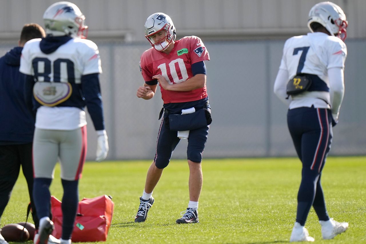 New England Patriots quarterback Mac Jones (10) warms up during an NFL football practice, Wednesday, Nov. 15, 2023, in Foxborough, Mass. (AP Photo/Steven Senne)