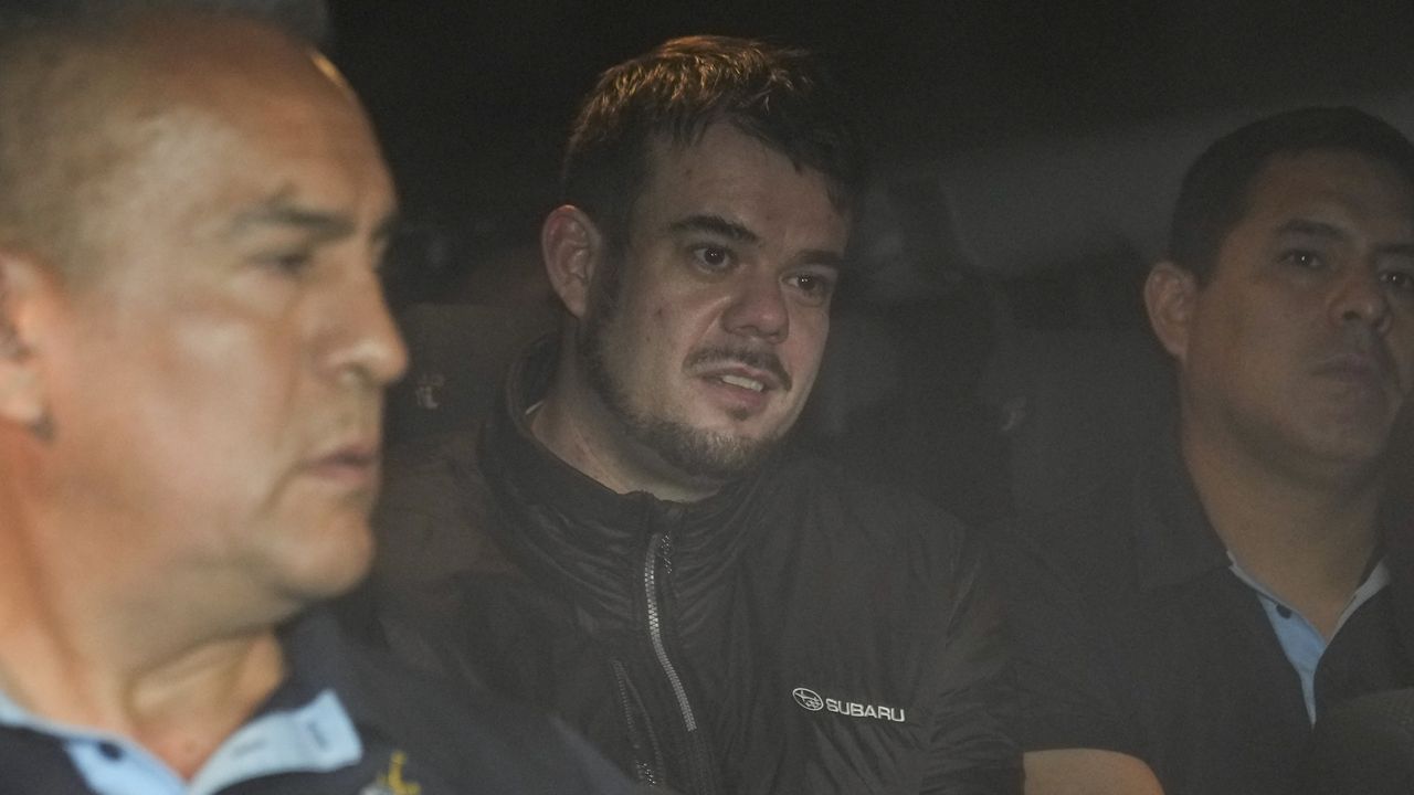 Joran van der Sloot is driven Thursday in a police vehicle from the Ancon I maximum-security prison on the outskirts of Lima, Peru. (AP Photo/Martin Mejia)