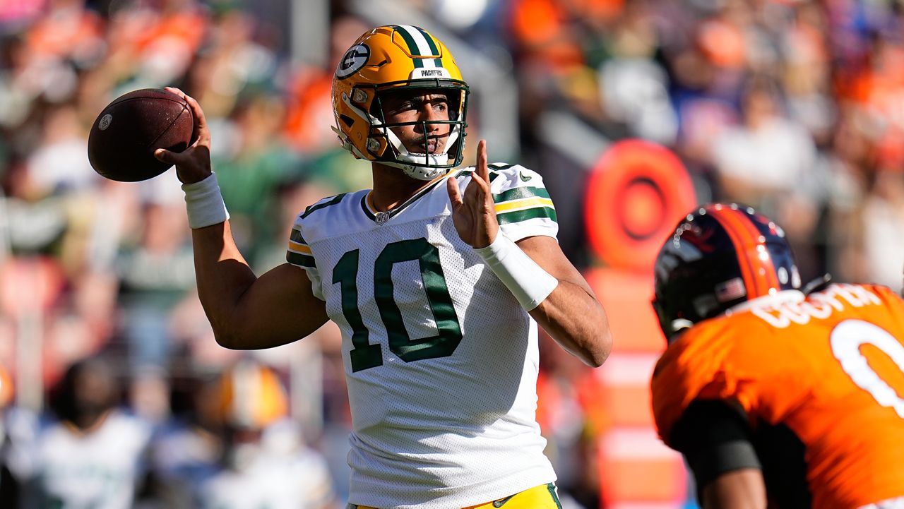 Green Bay Packers quarterback Jordan Love (10) passes against the Denver Broncos during the first half of an NFL football game in Denver