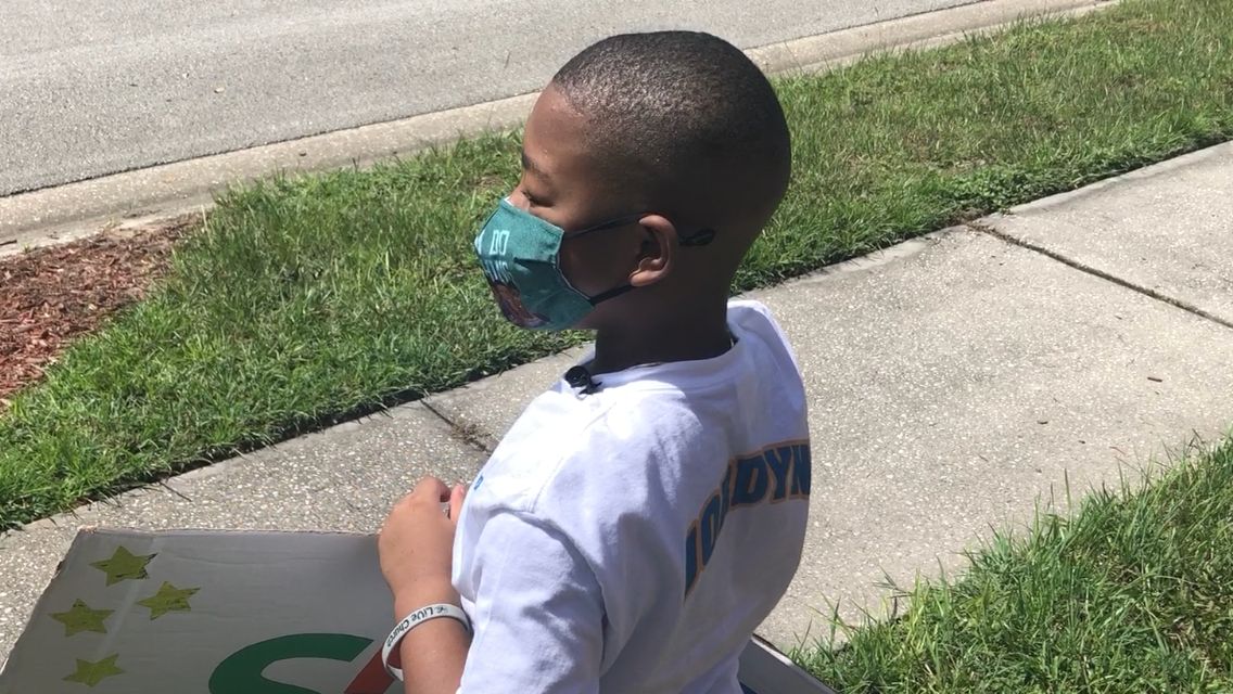 Jordyn Emile, a 9-year-old Seminole County resident, set up a table in his family's front yart recently to collect items and money for Hurricane Ida victims. (Spectrum News 13/Jeff Allen)