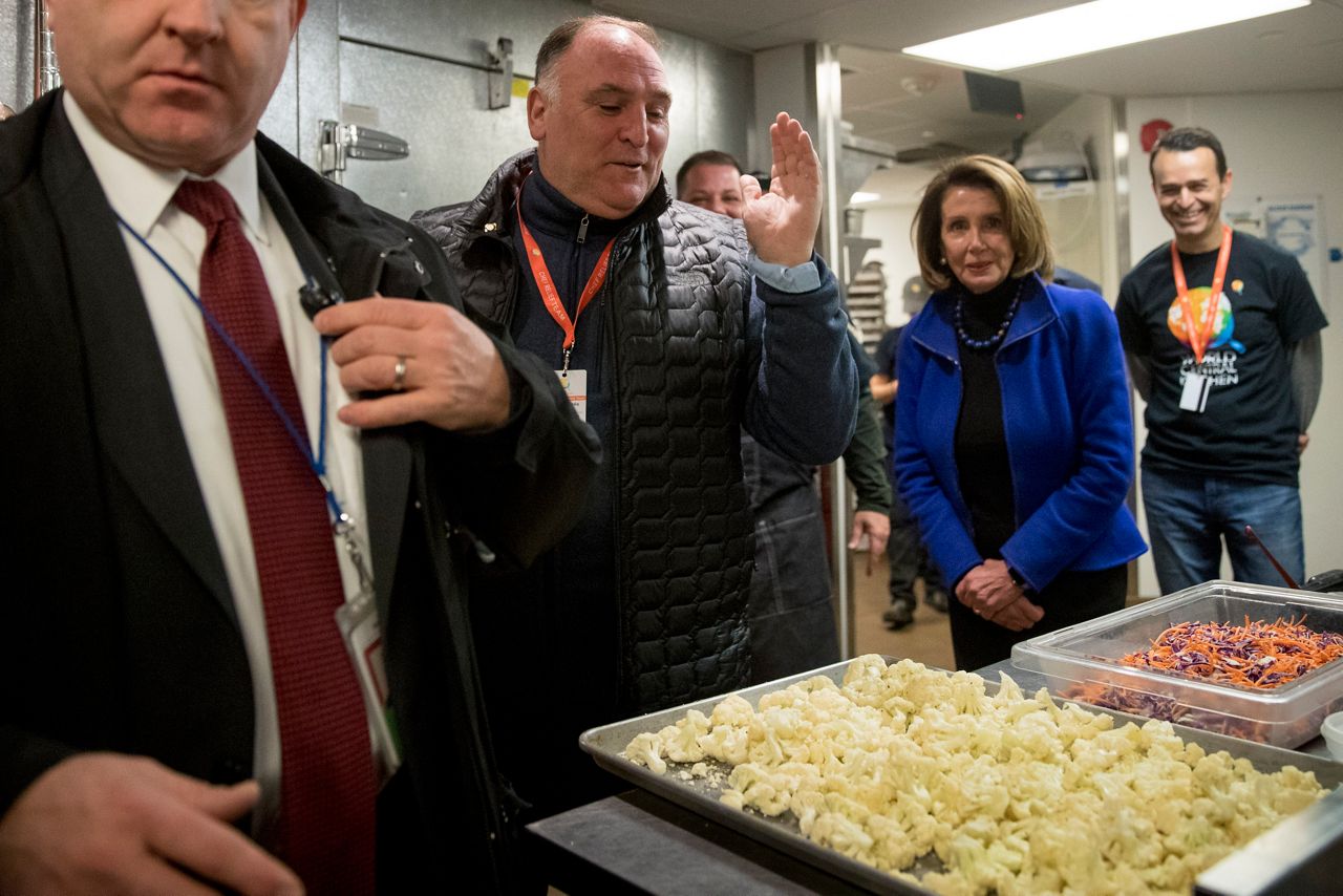 House Speaker Nancy Pelosi of Calif., second from right, and Chef Jose Andres, second from left, walk through one of the kitchens of World Central Kitchen, the not-for-profit organization started by Chef Jose Andres, in Washington, Tuesday, Jan. 22, 2019. (AP Photo/Andrew Harnik)