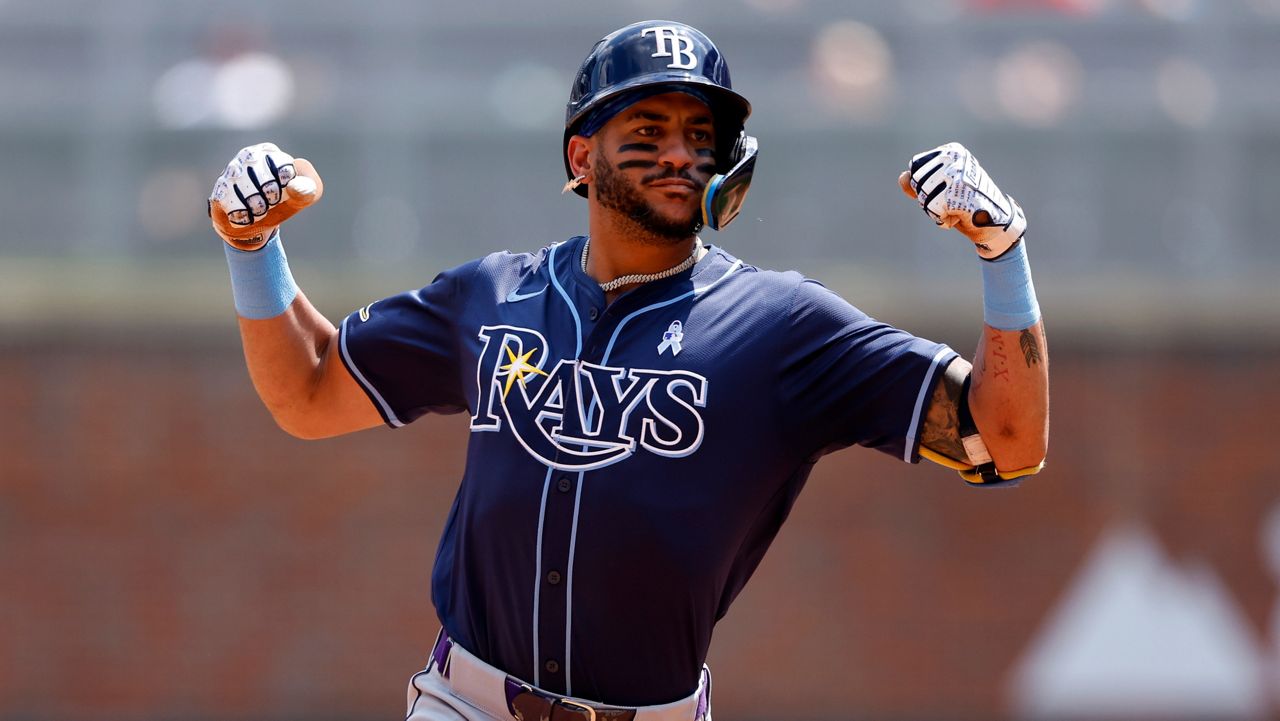 Tampa Bay Rays' Jose Siri celebrates as he rounds the bases after hitting a two-run homer during the ninth inning of a baseball game against the Atlanta Braves, Sunday, June 16, 2024, in Atlanta. (AP Photo/Butch Dill)