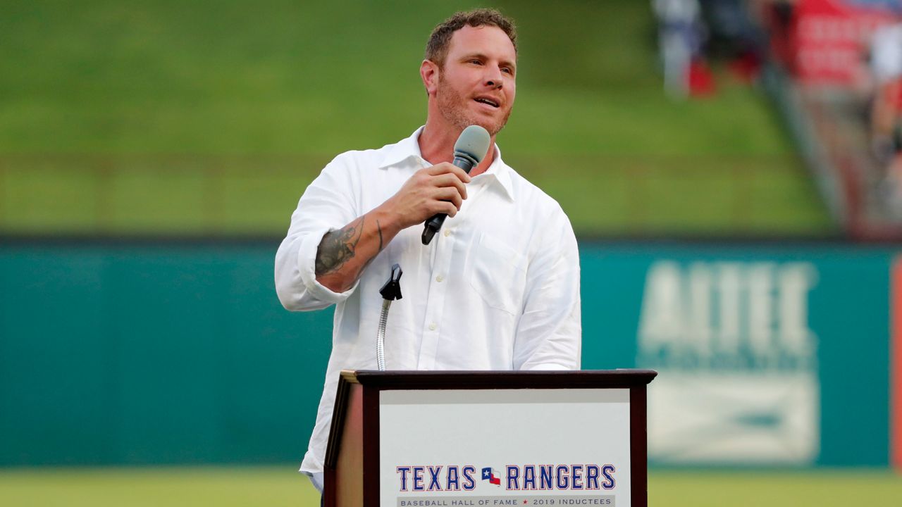 Former Texas Rangers player Josh Hamilton makes comments during a ceremony where the club inducted him into its Hall of Fame, before the team's baseball game against the Minnesota Twins in Arlington, Texas, Saturday, Aug. 17, 2019. (AP Photo/Tony Gutierrez)