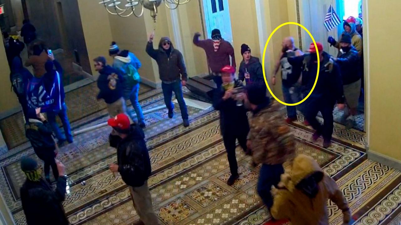 This image from U.S. Capitol Police security video and contained in the government's sentencing memorandum for Joshua Pruitt, circled in yellow, shows him entering the U.S. Capitol on Jan. 6, 2021. (Department of Justice via AP)