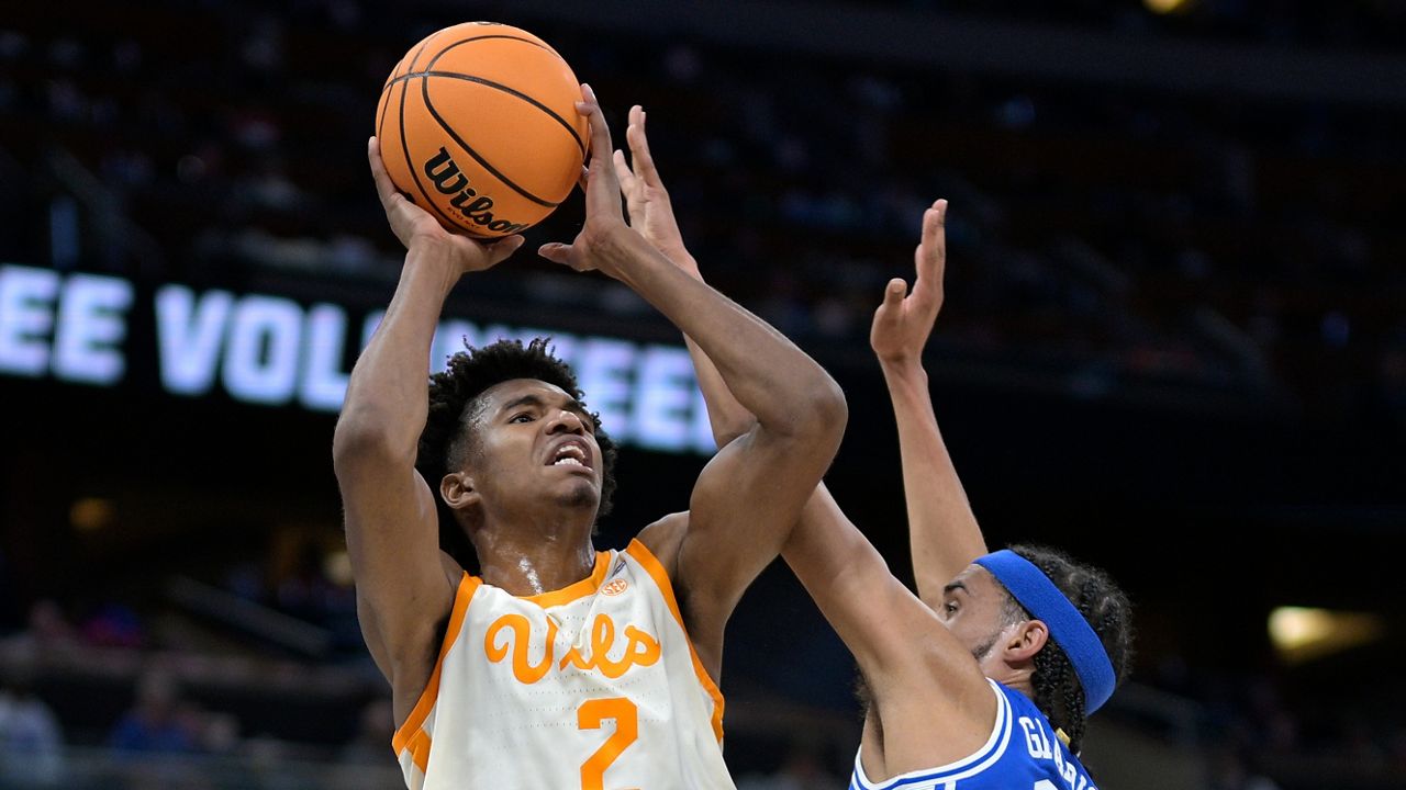 Tennessee forward Julian Phillips (2) shoots as Duke guard Jacob Grandison (13) defends during the first half of a second-round college basketball game in the NCAA Tournament on Saturday, March 18, 2023, in Orlando, Fla. (AP Photo/Phelan M. Ebenhack)