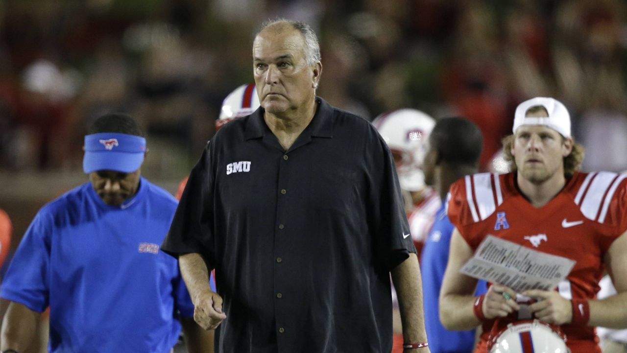 Then-SMU head coach June Jones walked off the field after a game against Texas Tech on Aug. 30, 2013. 