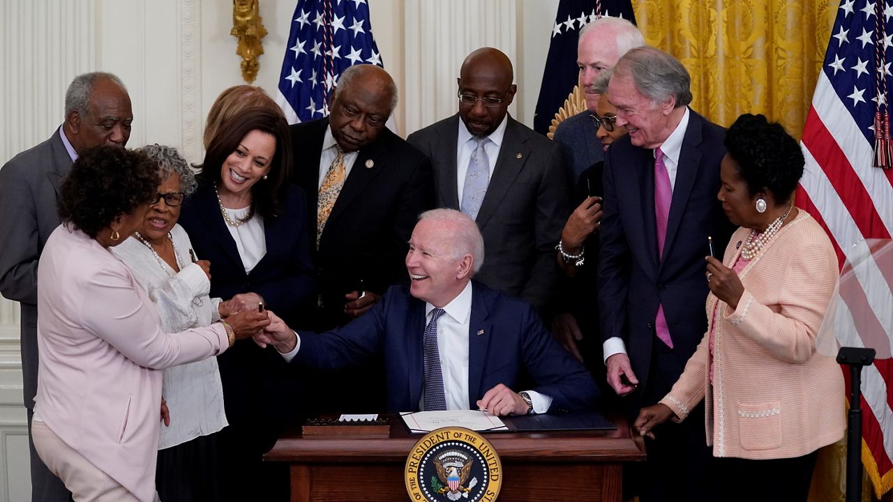 President Biden signs legislation declaring Juneteenth a national holiday.  (AP/Evan Vucci)