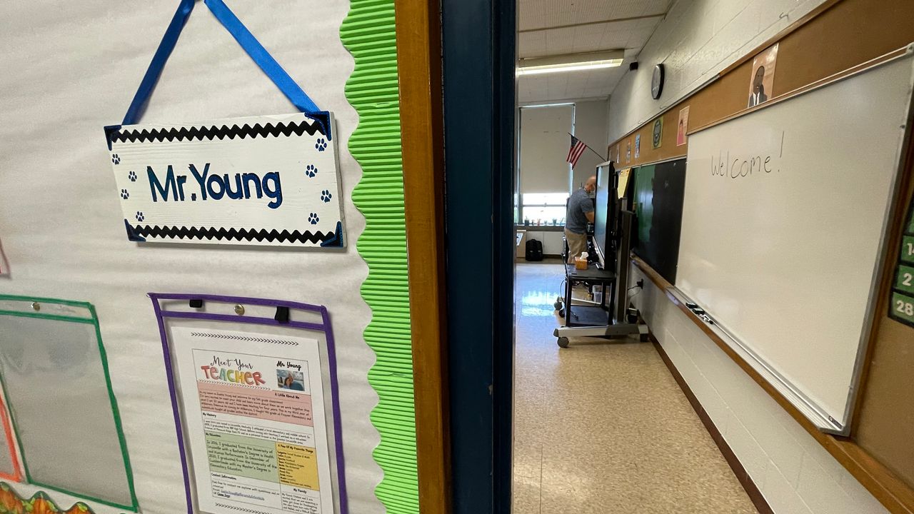 5th grade teacher Justin Young preps his classroom ahead of the first day of school (Spectrum News 1/Mason Brighton)