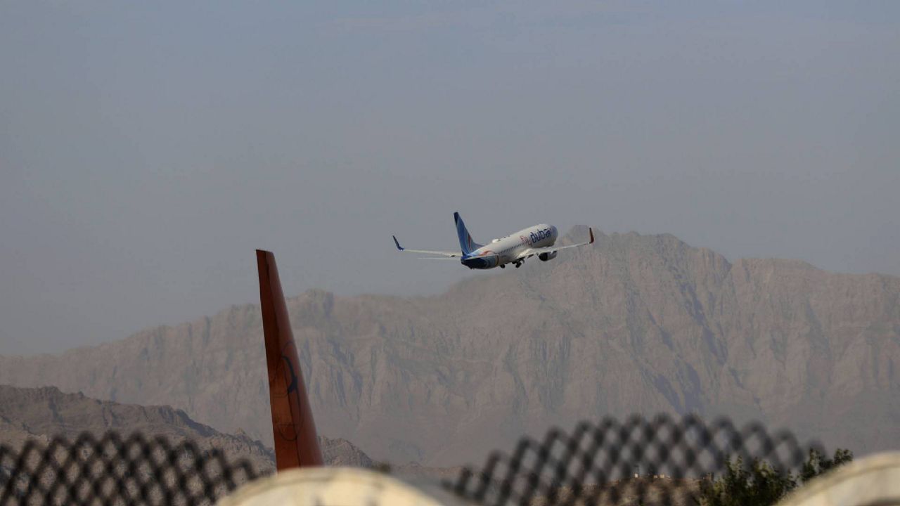 FILE - A plane departs Hamid Karzai International Airport in Kabul, Afghanistan, Sunday, July 4, 2021. (AP Photo/Rahmat Gul)
