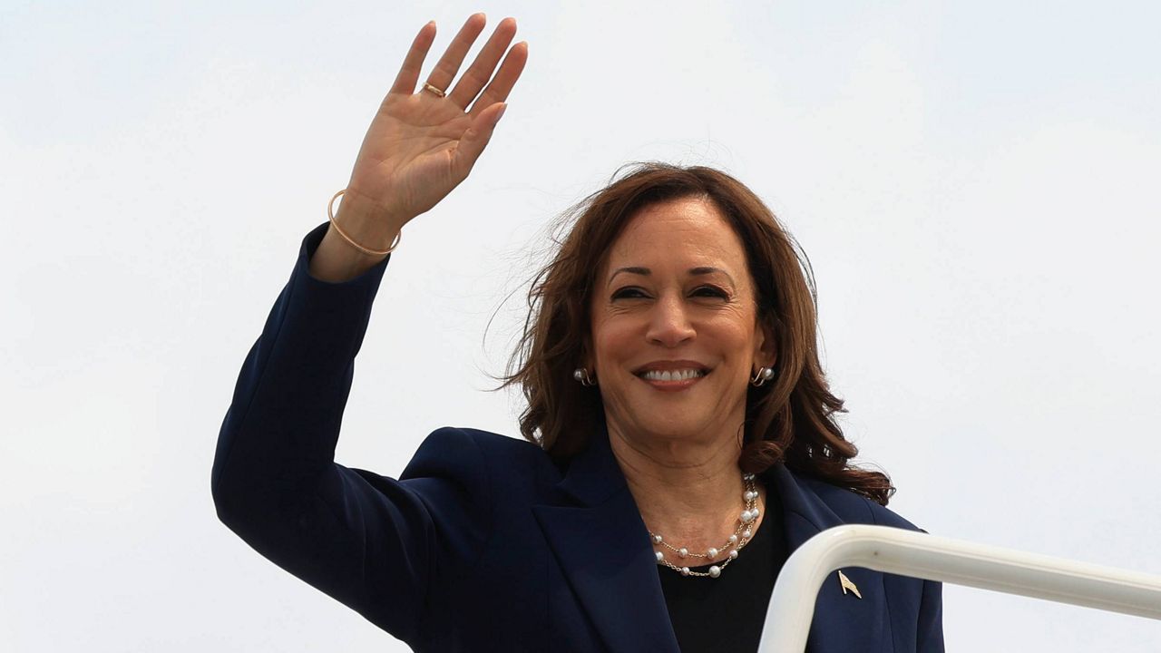 Vice President Kamala Harris waves as she boards Air Force Two following a campaign event, in Milwaukee, Wis., Tuesday, July 23, 2024. (Kevin Mohatt/Pool via AP)