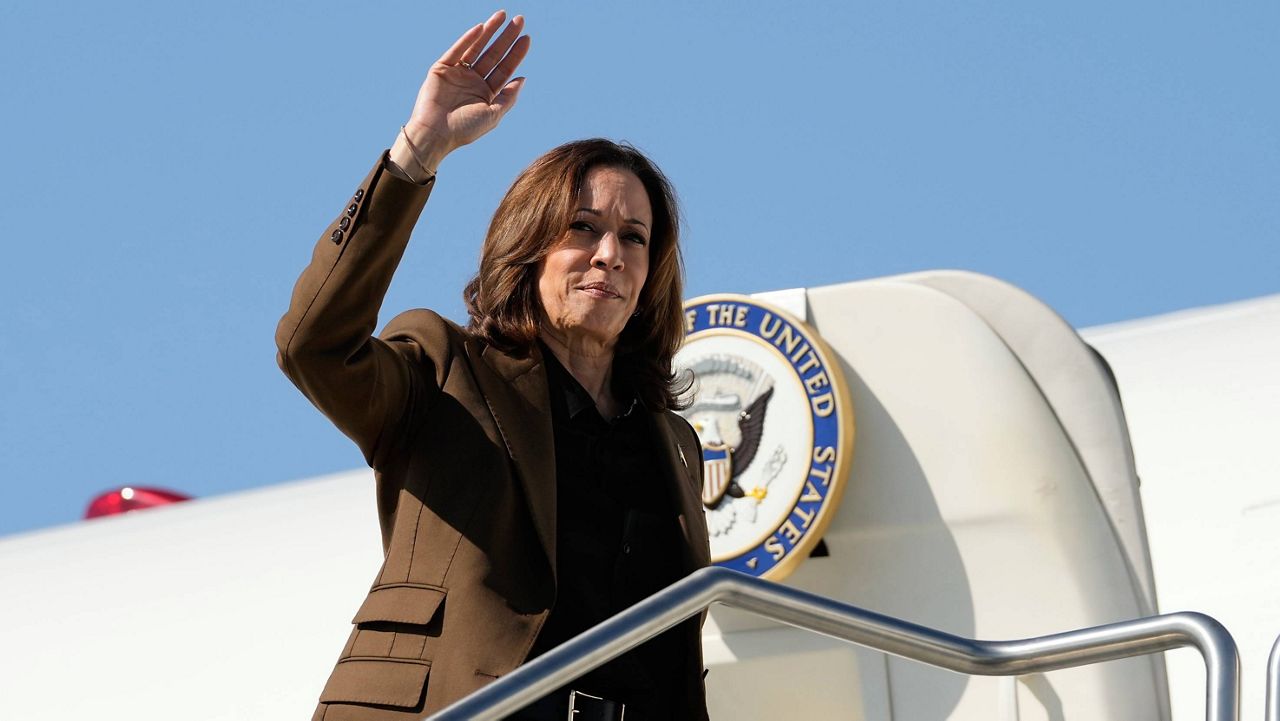 Democratic presidential nominee Vice President Kamala Harris waves as she boards Air Force Two, Friday, Oct. 11, 2024, at Sky Harbor International Airport in Phoenix, en route to Washington. (AP Photo/Ross D. Franklin)