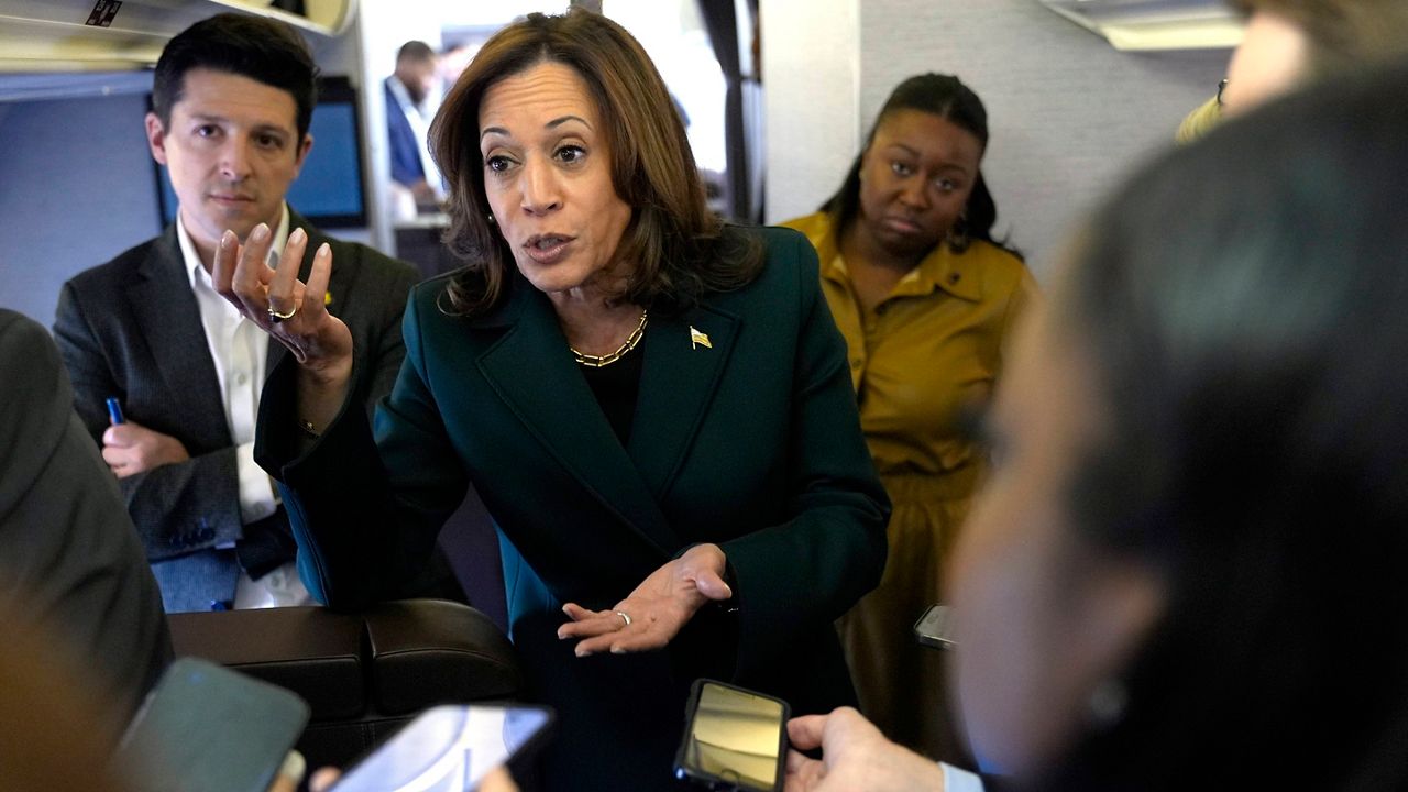 Democratic presidential nominee Vice President Kamala Harris speaks with members of the press on board Air Force Two at Philadelphia International Airport, Monday, Oct. 21, 2024, in Philadelphia, before departing to Michigan. (AP Photo/Jacquelyn Martin, Pool)