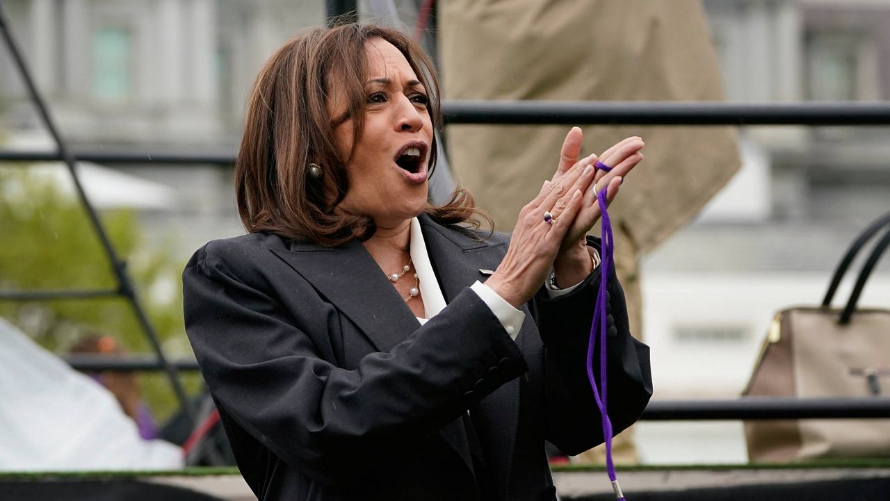Vice President Kamala Harris cheers after blowing a whistle to start a race as she participates in activities on the South Lawn of the White House during Monday's Easter Egg Roll. (AP Photo/Susan Walsh)