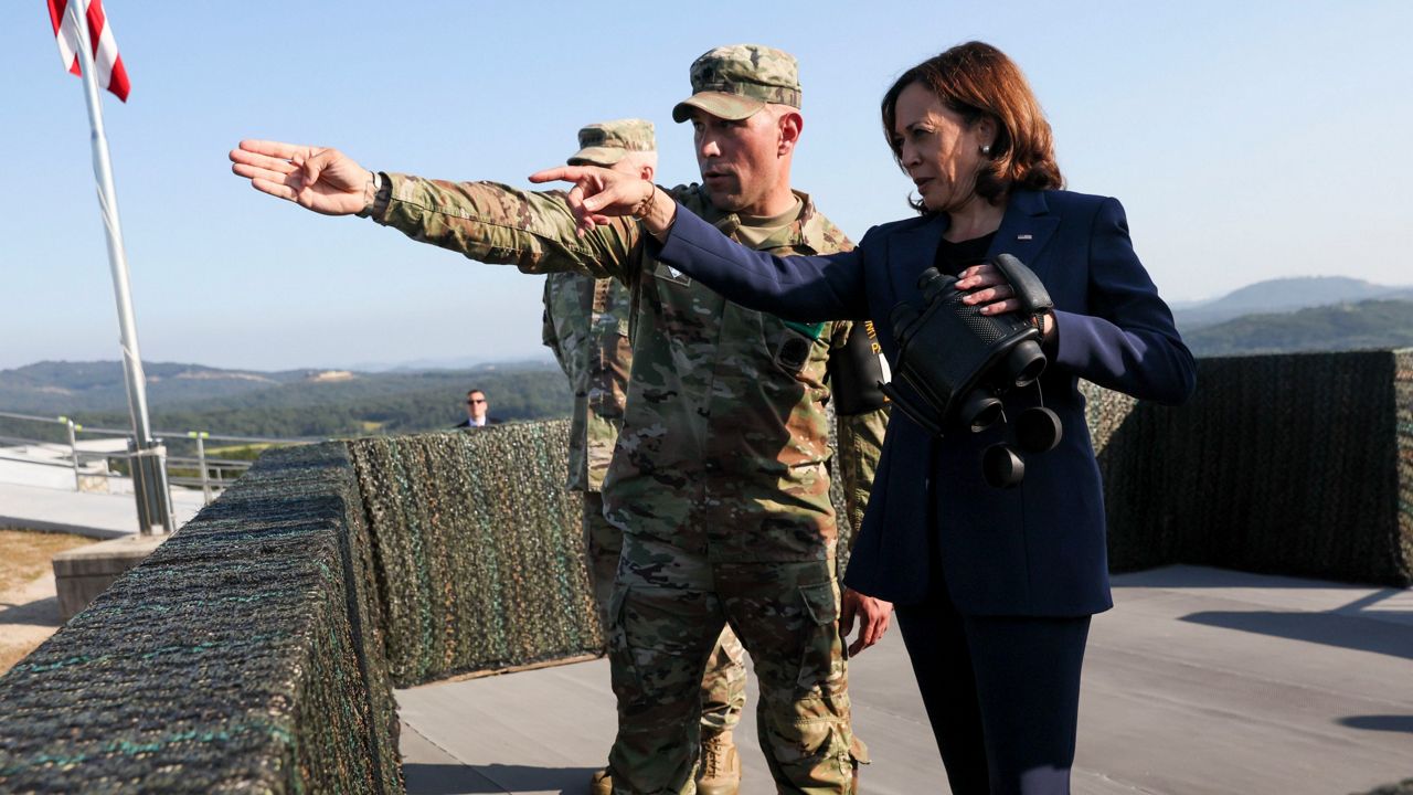 Vice President Kamala Harris, right, uses binoculars Thursday at the military observation post as she visits the Demilitarized Zone (DMZ) separating the two Koreas. (Leah Millis/Pool Photo via AP)