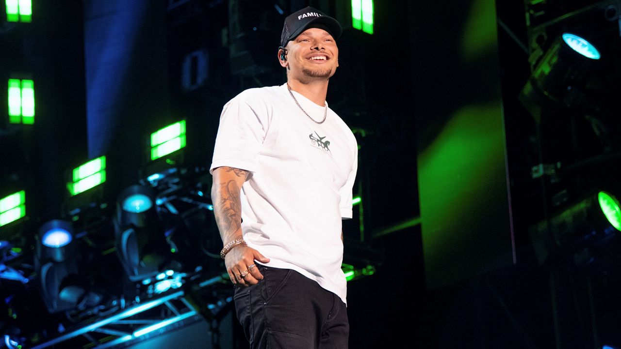 FILE - Kane Brown performs during CMA Fest 2022 on Friday, June 10, 2022, at Nissan Stadium in Nashville, Tenn. Brown is among the headliners at this year's New Orleans Jazz & Heritage Festival, which takes place over two weekends beginning April 28. (Photo by Amy Harris/Invision/AP, File)