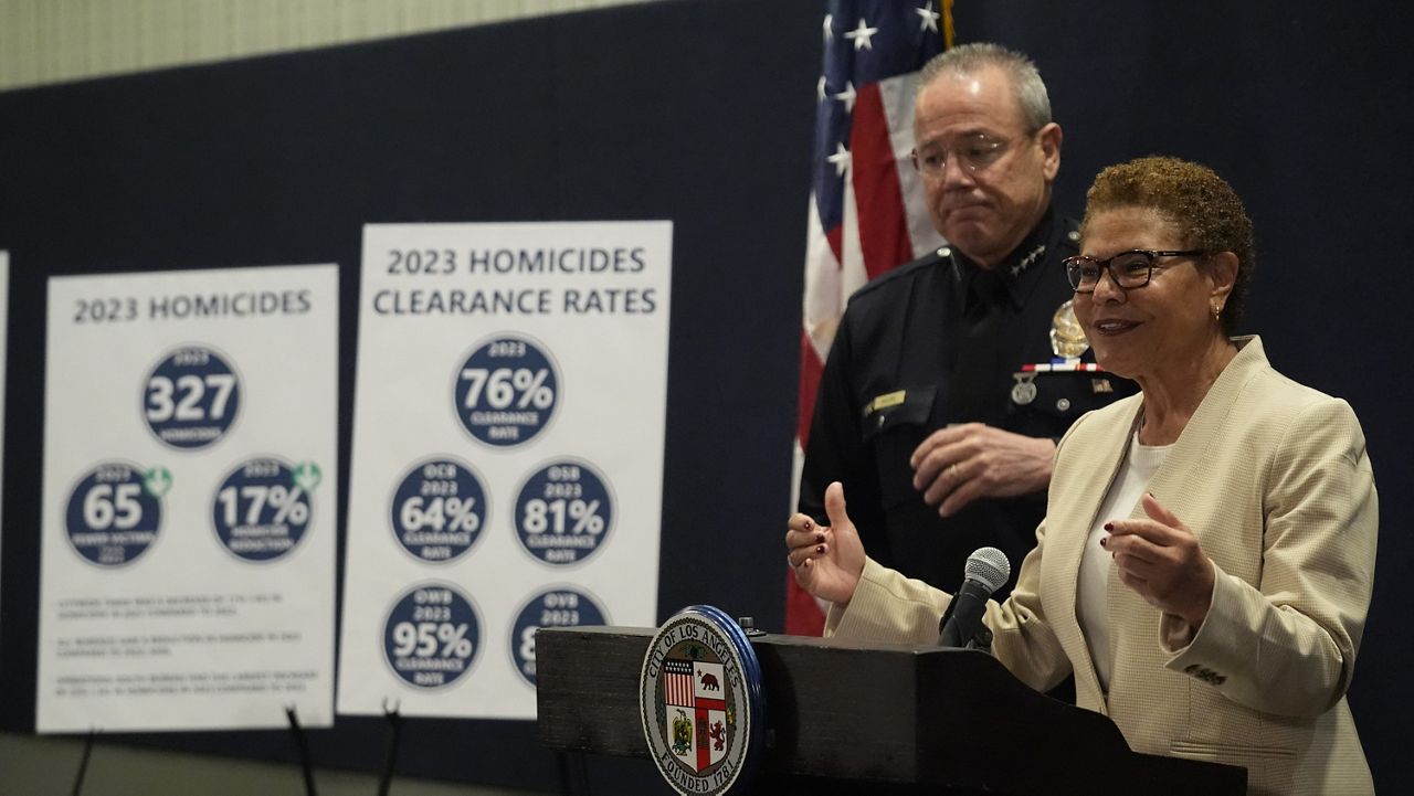 Los Angeles Mayor Karen Bass and the outgoing Los Angeles Police Chief Michel Moore discuss the city's 2023 crime statistics and safety priorities for 2024 amid the search for a new leader for the department at a news conference in Los Angeles Wednesday, Jan. 24, 2024. (AP Photo/Damian Dovarganes)