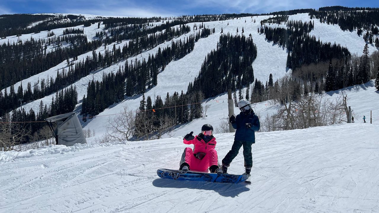 Katherine G snowboarding in the snow. (Katherine G)