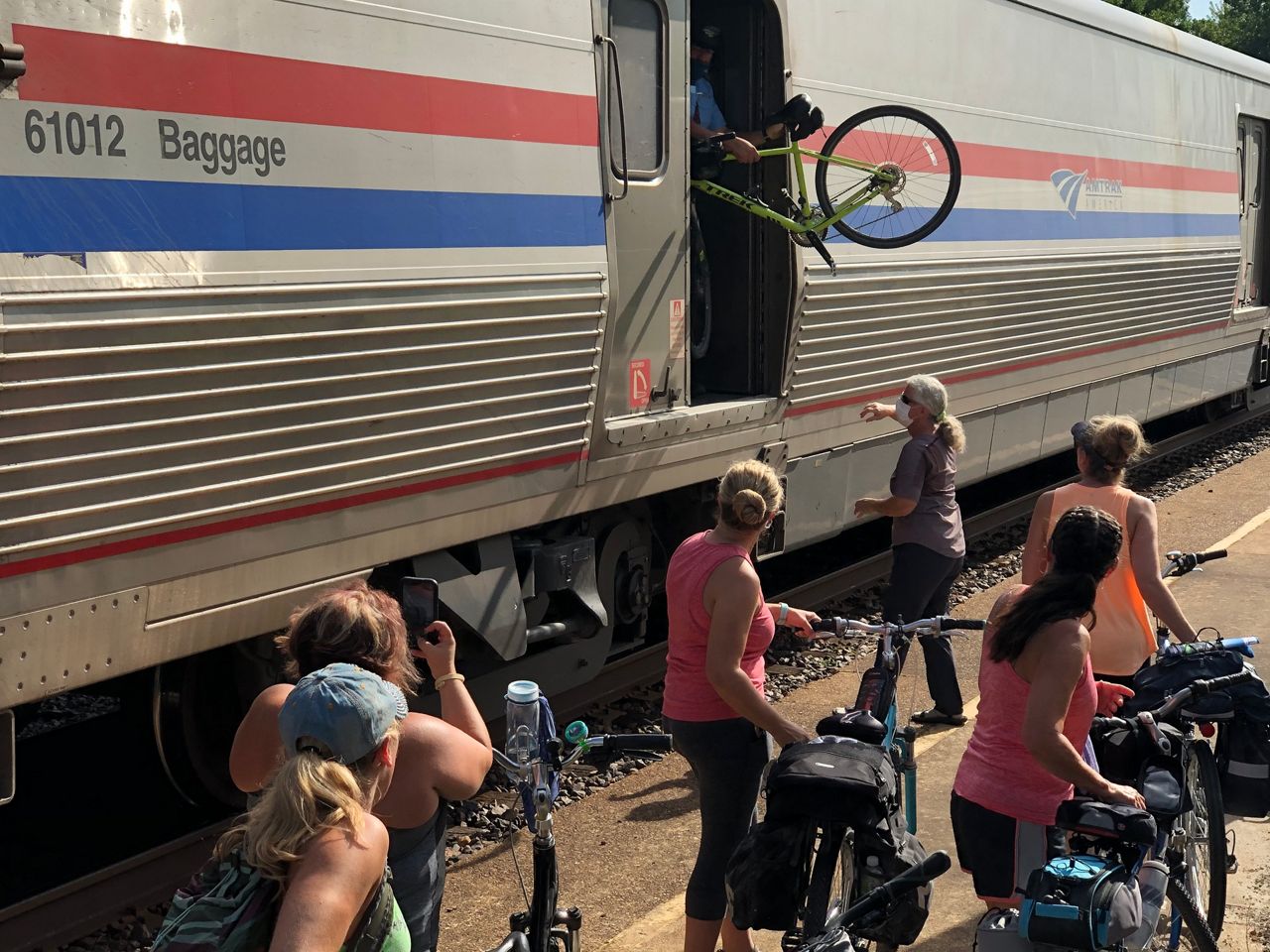 People load their bikes onto the Missouri River Runner for a trip to the Katy Trail. (Provided: A train employee waves as the Missouri River Runner pulls out of a station along the 283-mile cross-state route. (Provided: Tammy Bruckerhoff, director of Tourism and Economic Development for the city of Hermann)