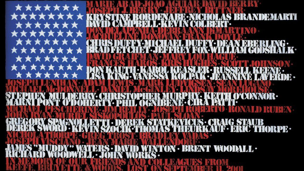 A flag made by the wife of one of the victims with all the names of those who perished as the red and white stripes of the U.S. flag is displayed in the Midtown Manhattan office. 