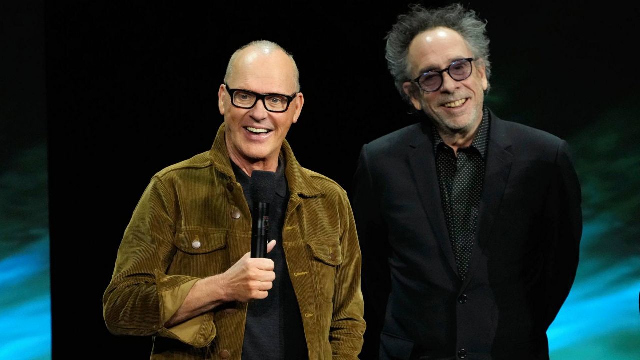Michael Keaton, left, star of the upcoming film "Beetlejuice Beetlejuice," discusses the film alongside director Tim Burton during the Warner Bros. Pictures presentation at CinemaCon 2024 on Tuesday in Las Vegas. (AP Photo/Chris Pizzello)