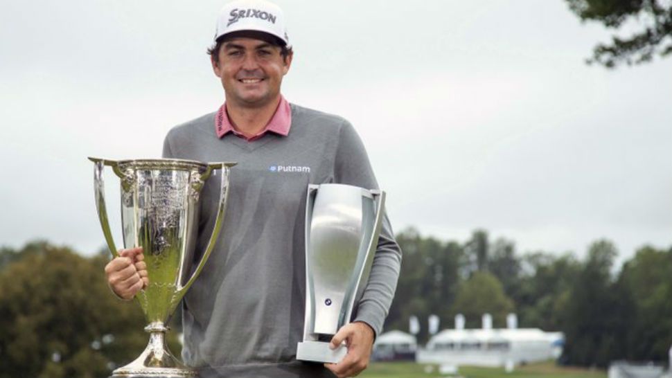 Keegan Bradley poses with the two trophies following the BMW Championship golf tournament at the Aronimink Golf Club, Monday, Sept. 10, 2018, in Newtown Square, Pa. Bradley held off Justin Rose in a sudden-death playoff to win the rain-plagued BMW Championship for his first PGA Tour victory in six years. (AP Photo/Chris Szagola)