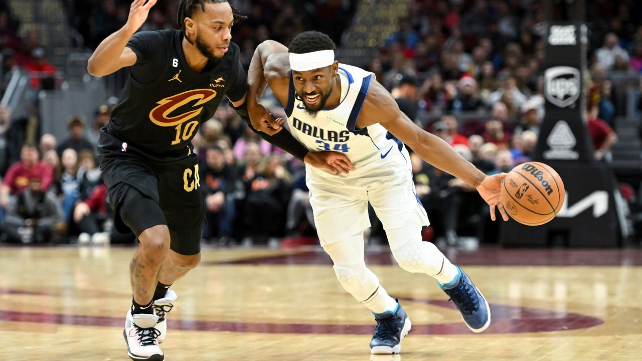 Kemba Walker drives against Darius Garland during a game on Saturday, Dec. 17, 2022 in Cleveland.